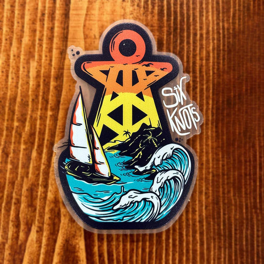 Overhead view of the Six Knots 'Tropical Storm' vinyl sticker featuring the iconic Six Knots buoy design with a sailboat battling crashing waves inside a tropical storm. This high-quality, waterproof and weather-resistant decal is perfect for coolers, tackle boxes, water bottles, boats, and rugged outdoor gear. Built for durability and coastal adventure style.