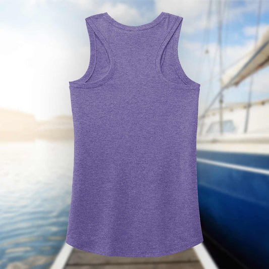 Back view of the purple Six Knots Tropical Storm Women's Tank Top set against a blurred marina background. This lightweight, ultra-soft women's tank is crafted from a breathable cotton-polyester blend for all-day comfort. Ideal for beach outings, coastal vacations, boating adventures, summer festivals, and relaxed waterfront style, it's the perfect warm-weather essential for active coastal living.