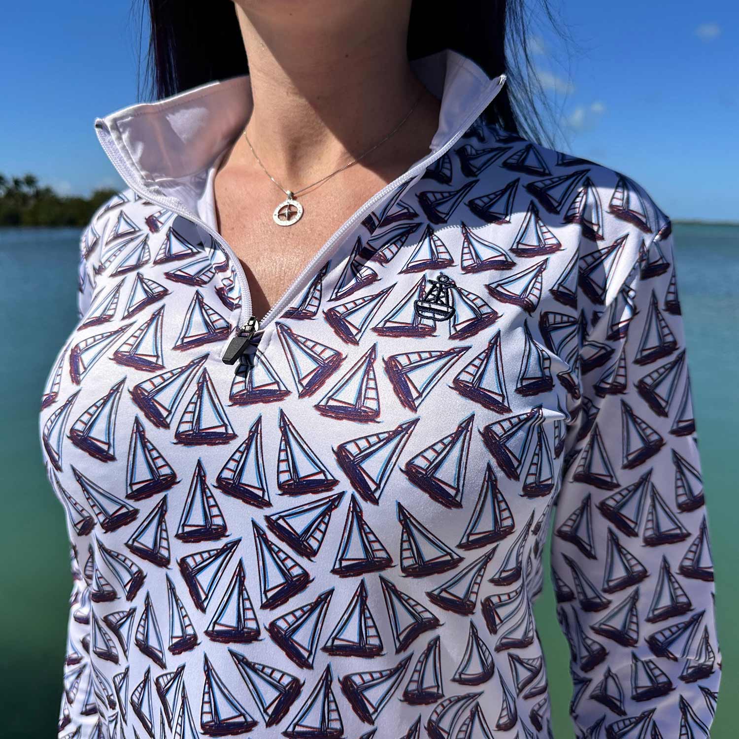 Close-up of the Six Knots Under Sail Women's Performance Quarter Zip highlighting the intricate repeating hand-sketched sailboat pattern — lightweight, breathable, moisture-wicking pullover with UPF sun protection and all-weather comfort, perfect for fishing, boating, sailing, and coastal lifestyle adventures