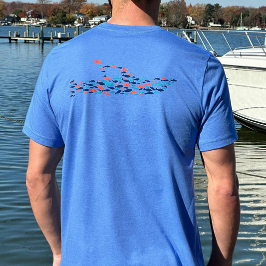 Rear view of man at a Maryland marina wearing the blue Six Knots Sink or Swim Classic T-Shirt. This ultra-soft, lightweight unisex tee is made from a breathable cotton-polyester blend and features a detailed back graphic of a boat formed by a school of fish. Ideal for everyday wear, weekend lounging, beach trips, coastal vacations, casual outings, and relaxed waterfront living.